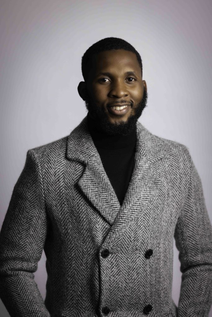 Corporate headshot of man in wool coat, Houston business photography