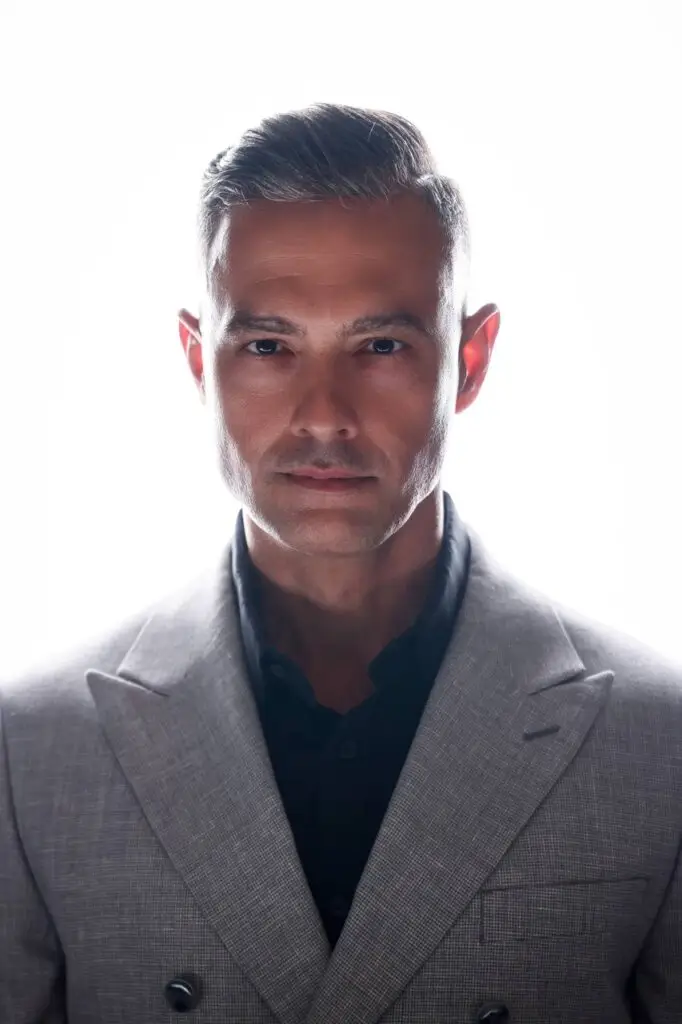 Professional corporate headshot of man in gray suit, Houston headshot photography