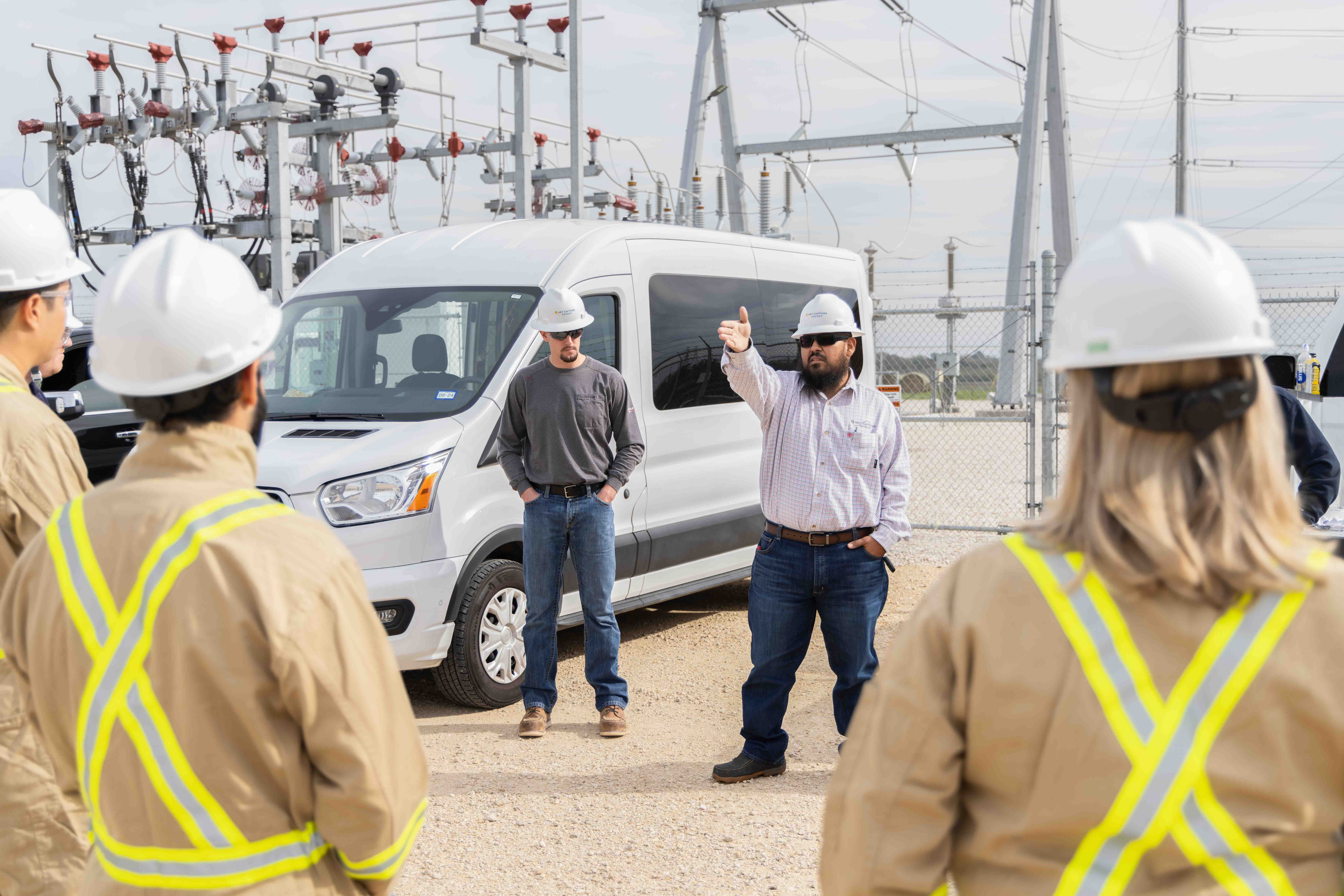 Utility workers in safety gear at commercial job site, Houston corporate photography