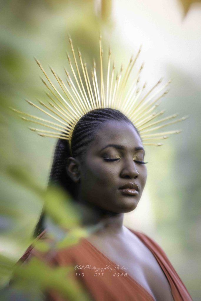 Portrait of woman with sun-ray headpiece and closed eyes, artistic Houston photography