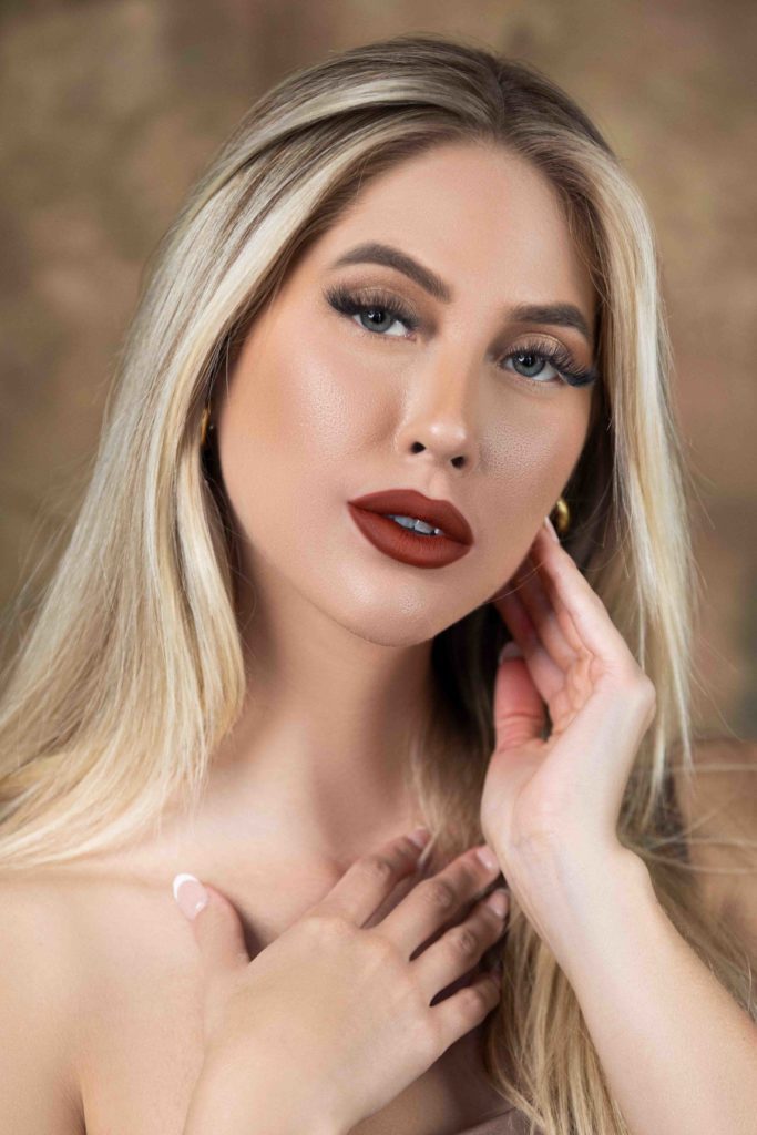 Beauty portrait of blonde woman with dramatic red lipstick, Houston photography studio