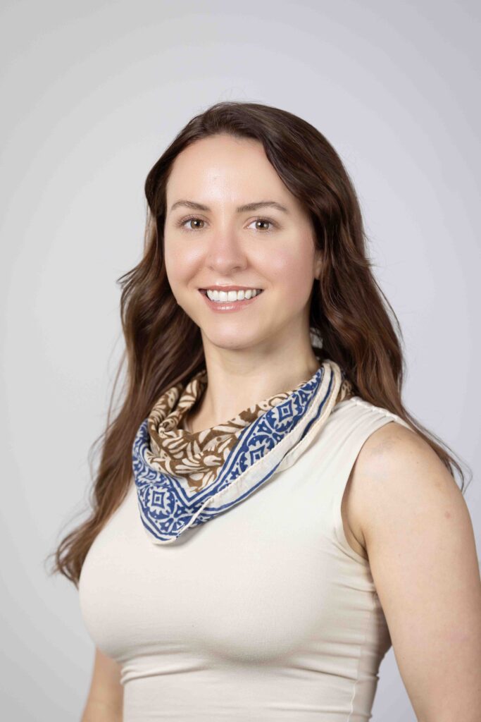 Professional headshot of woman in blue paisley scarf, Houston headshot photography