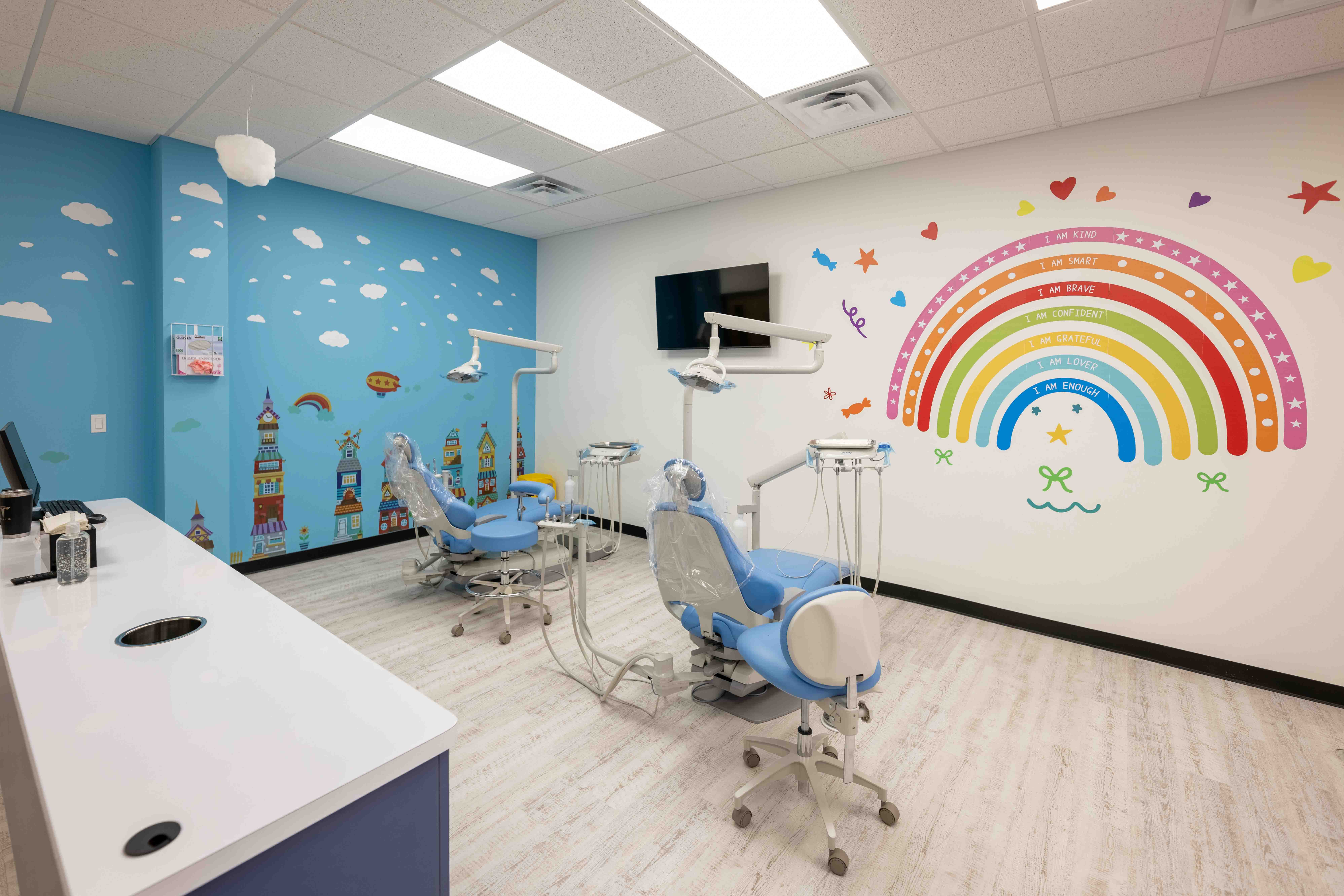 Modern pediatric dental office interior with colorful mural