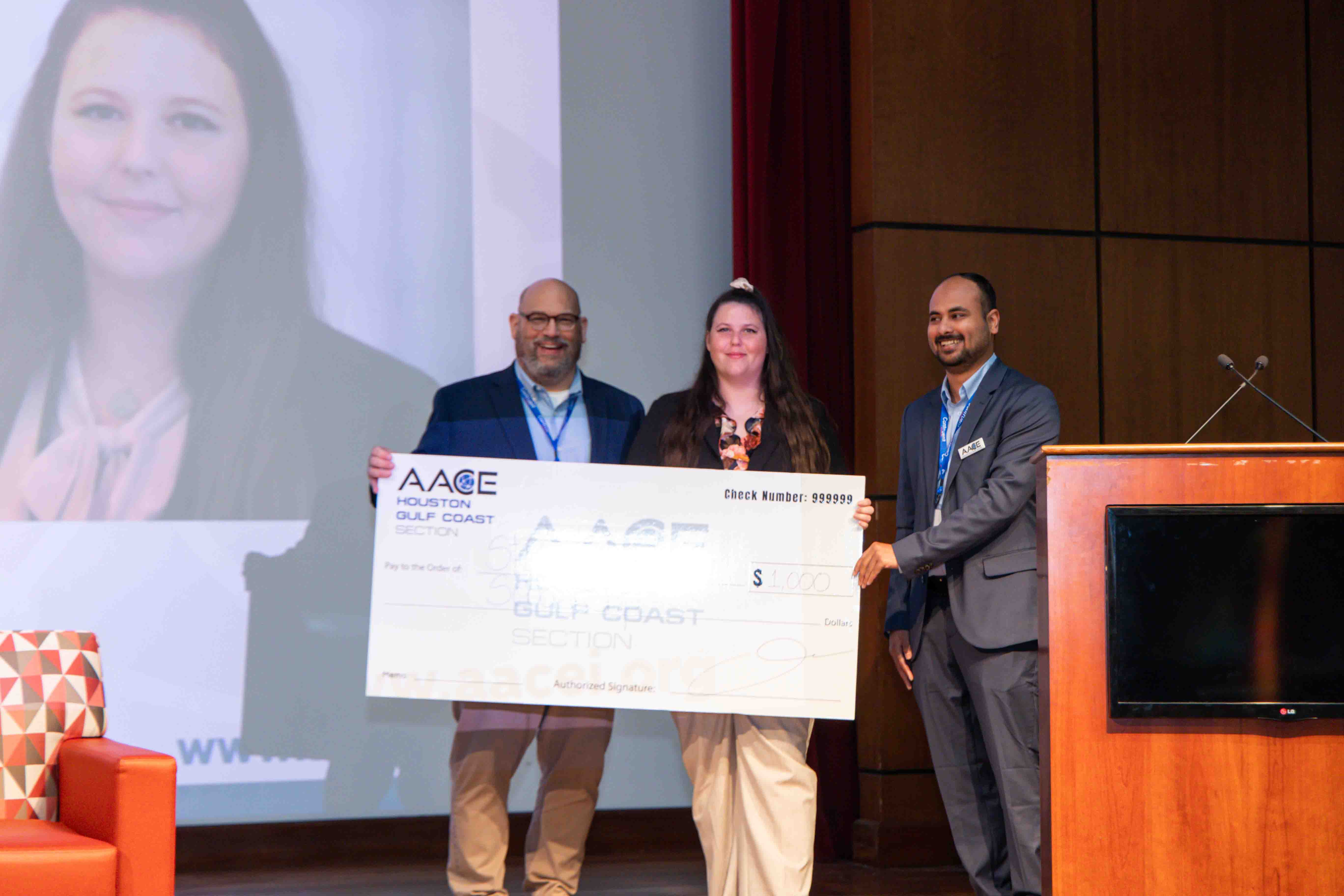 Corporate award presentation with businesswoman receiving recognition
