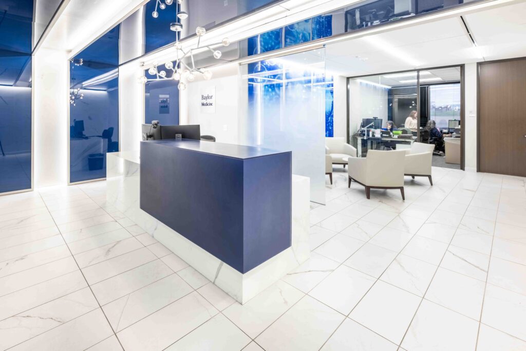 Modern office reception area with navy front desk, Houston commercial real estate photography