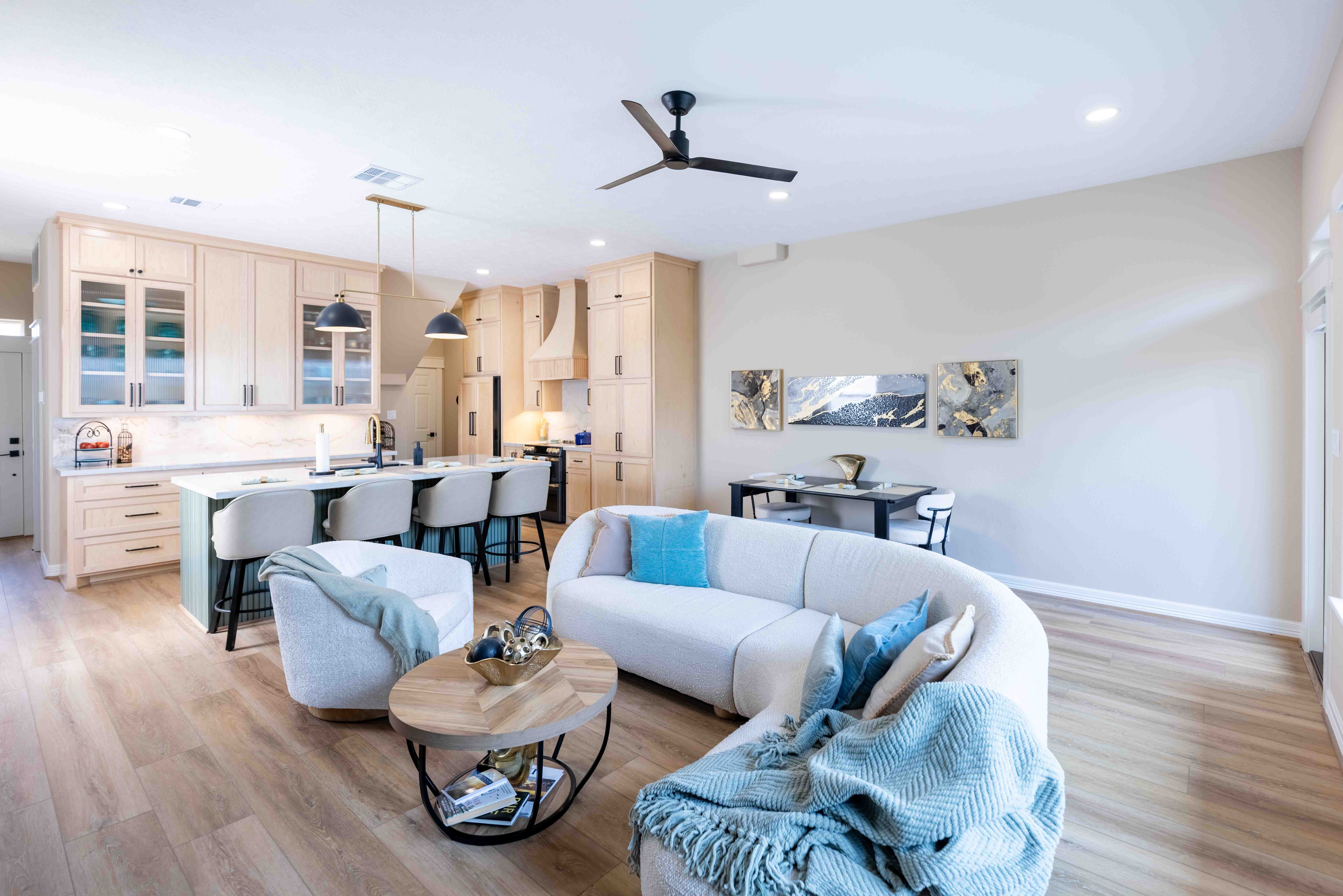 Living room interior with blue-accented furniture, Houston real estate photography